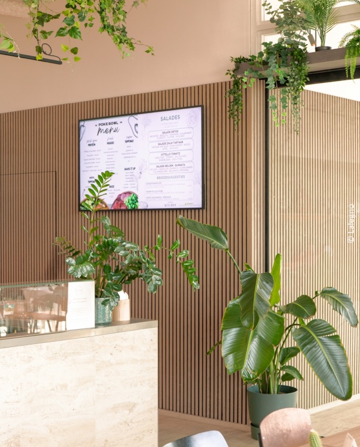 interior with plants and acoustic panels on the wall